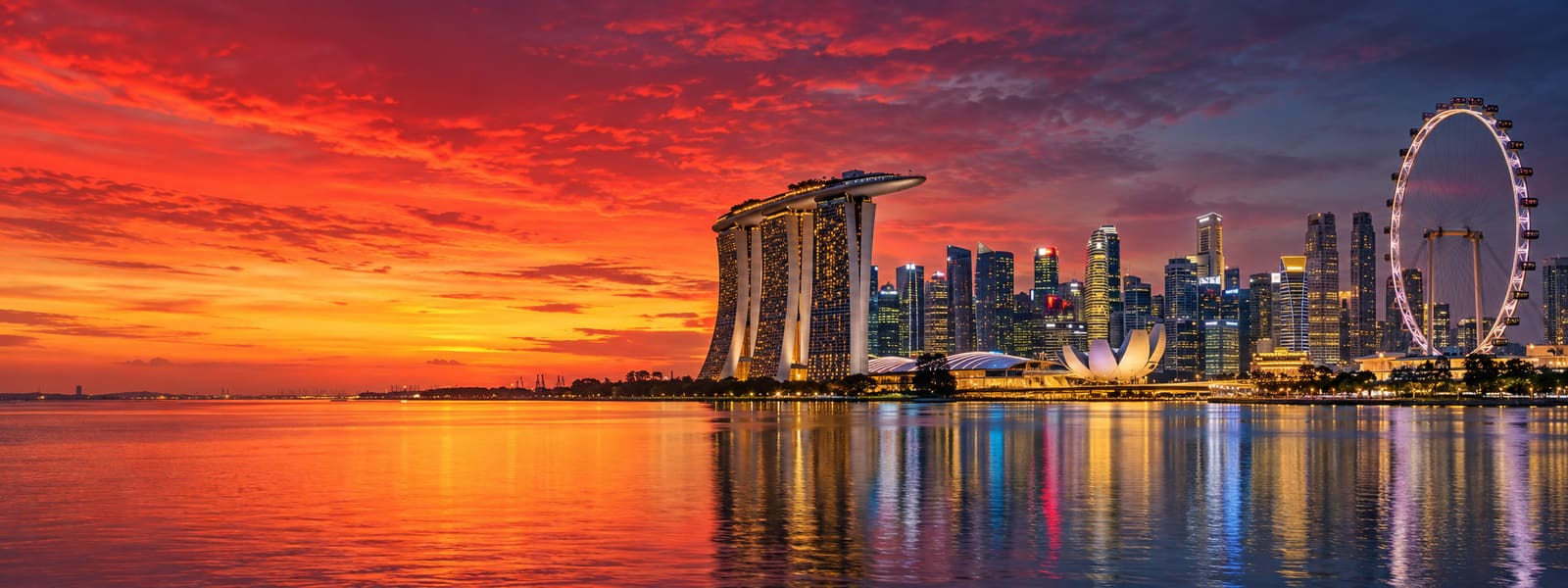 The Singapore skyline across Marina Bay at dusk