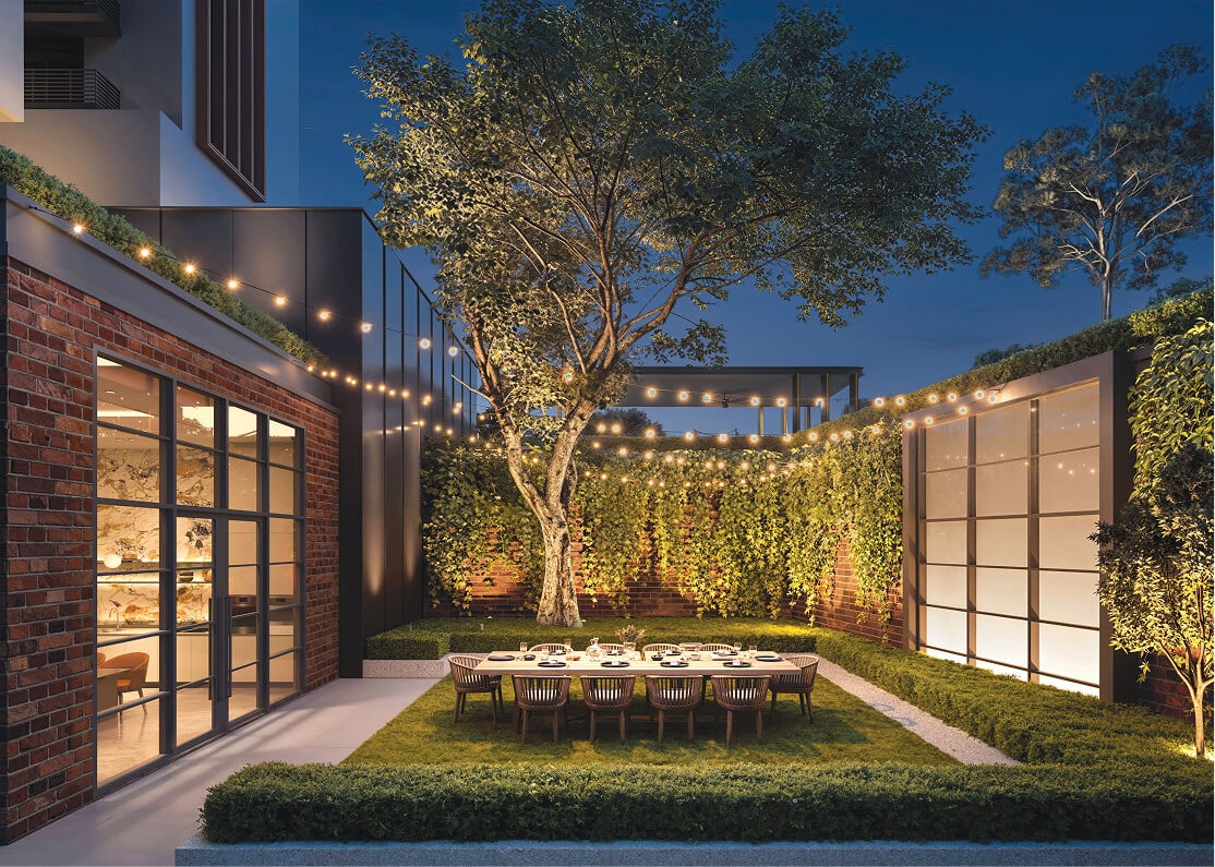 Artist's impression of the Courtyard Garden at night with a long outdoor dining table