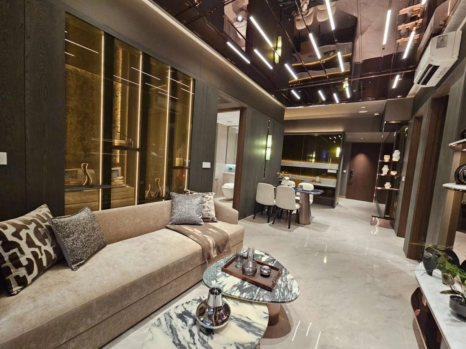 Photograph of the living area in the 2-bedroom show suite, looking towards the dining table