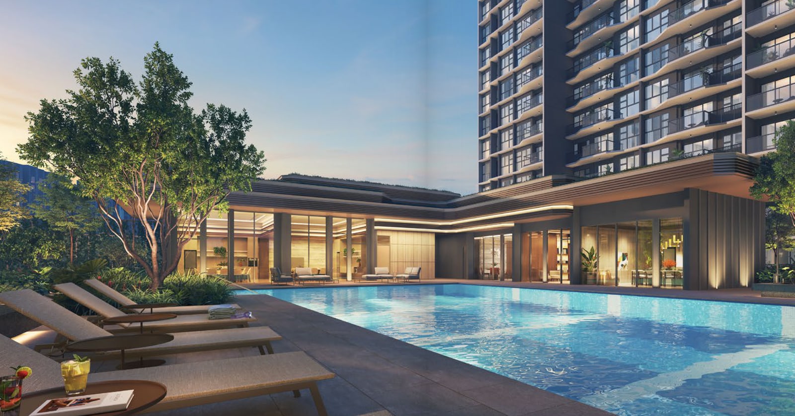 Artist's impression of a pool deck with sun loungers and a clubhouse below a residential block at dusk
